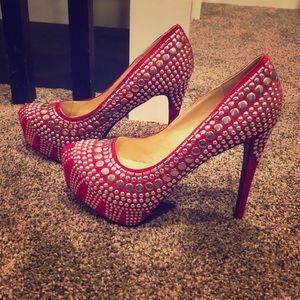 Red studded pumps